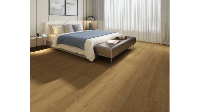 Der Boden H&S Floor Sarl in einem Schlafzimmer. Das Vinyl hat eine wärmende Holzoptik